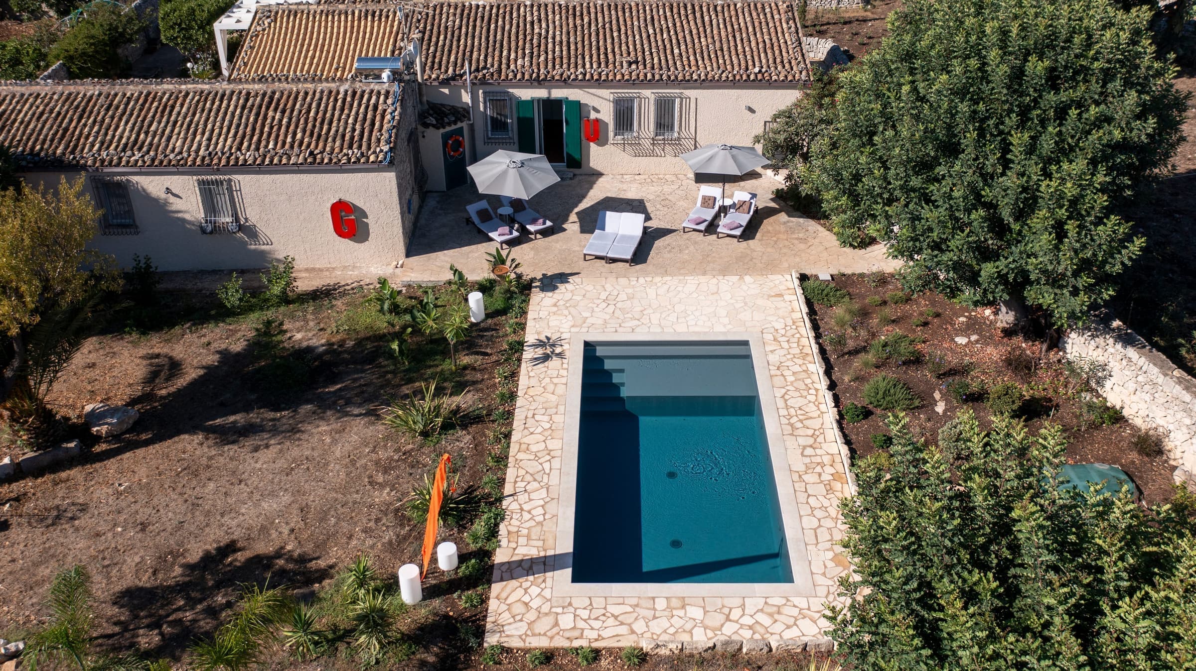 Drone view showcasing the property's hillside setting