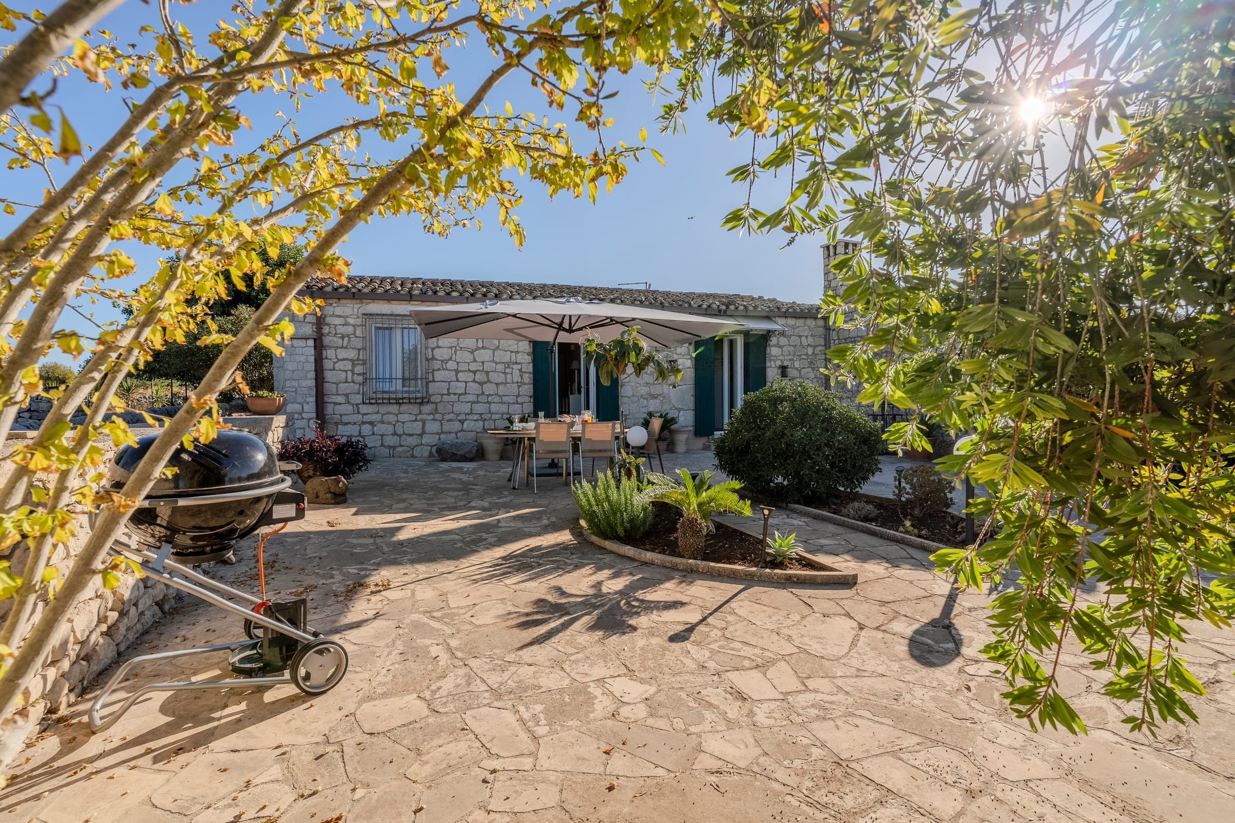 Welcoming entrance terrace with garden views