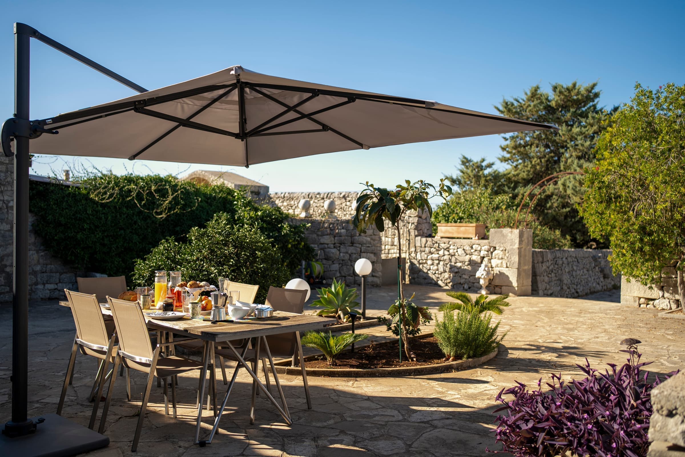 Comfortable loungers nestled among Mediterranean plants