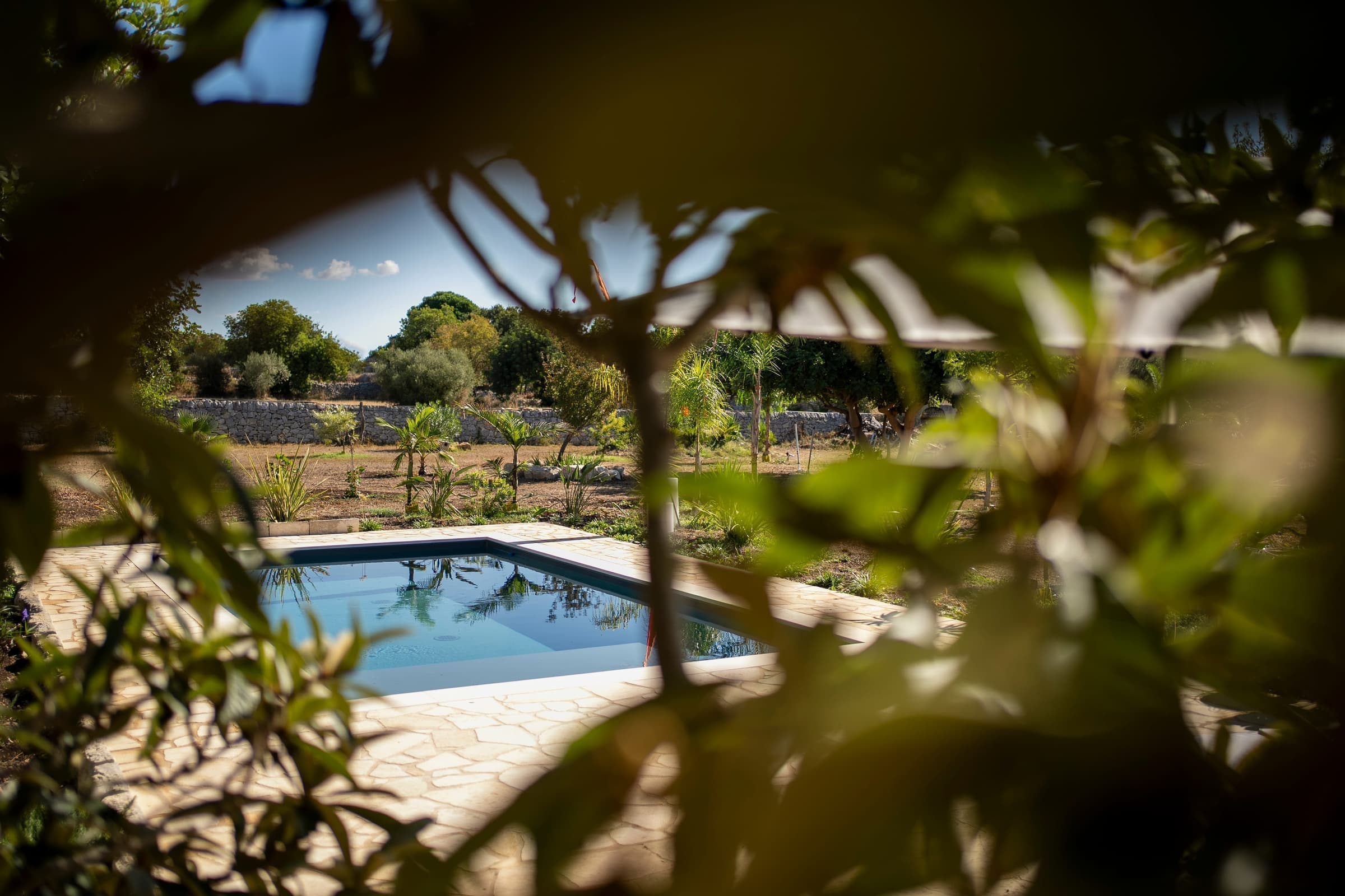 Crystal clear pool under the Sicilian sun
