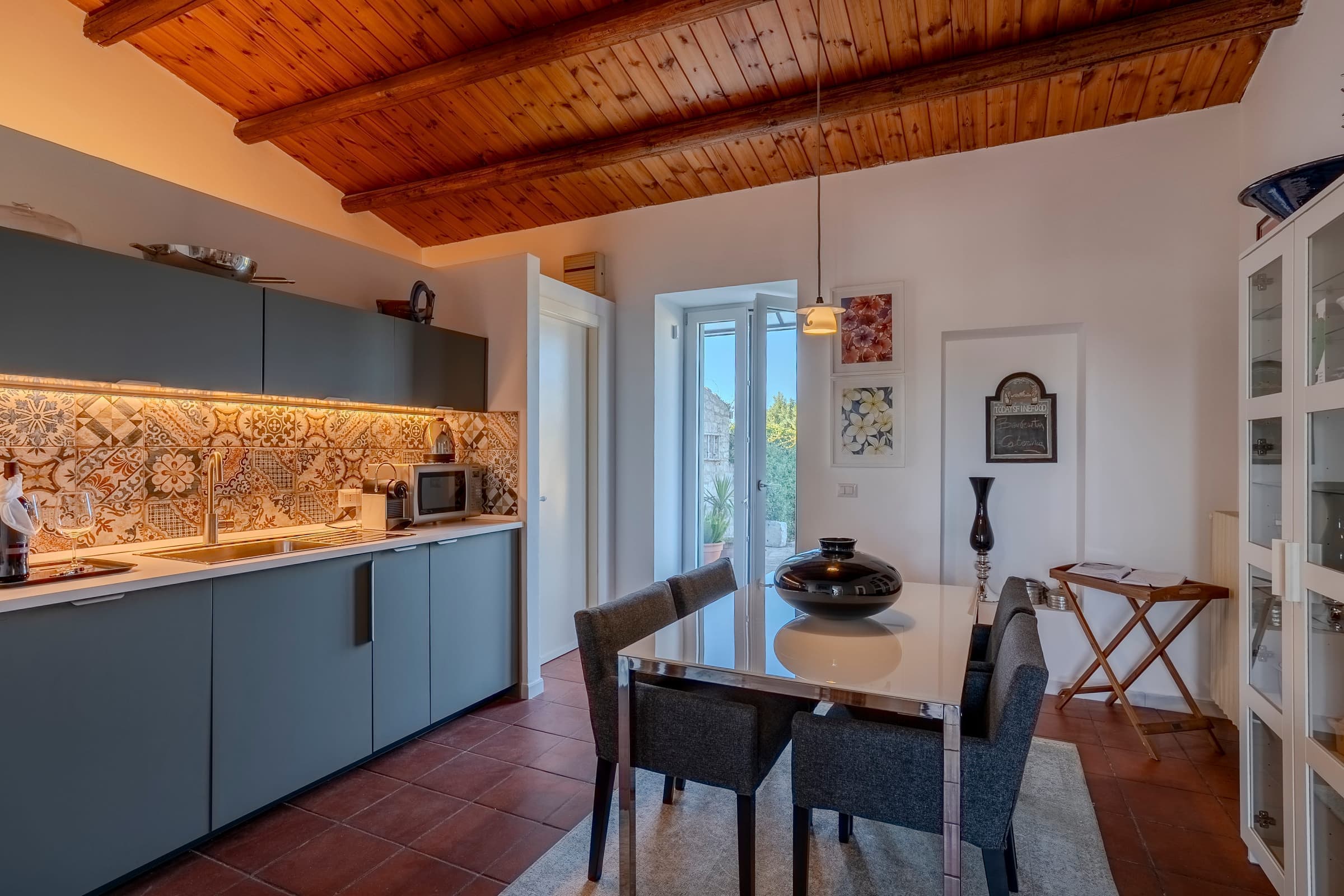 Modern kitchen with traditional Sicilian tile accents