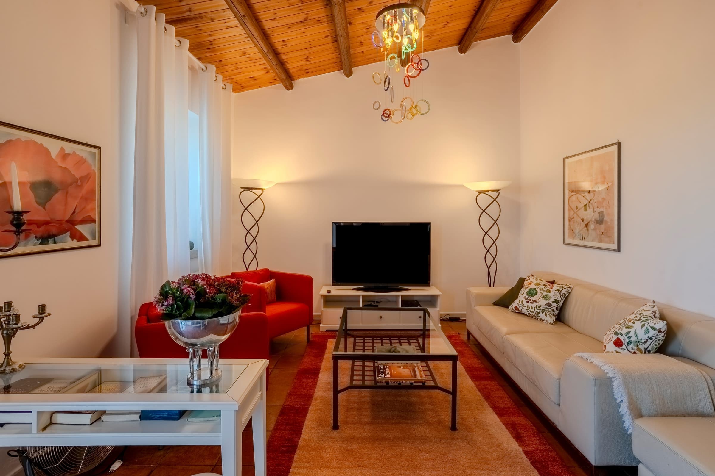Cozy living room with authentic vaulted ceilings