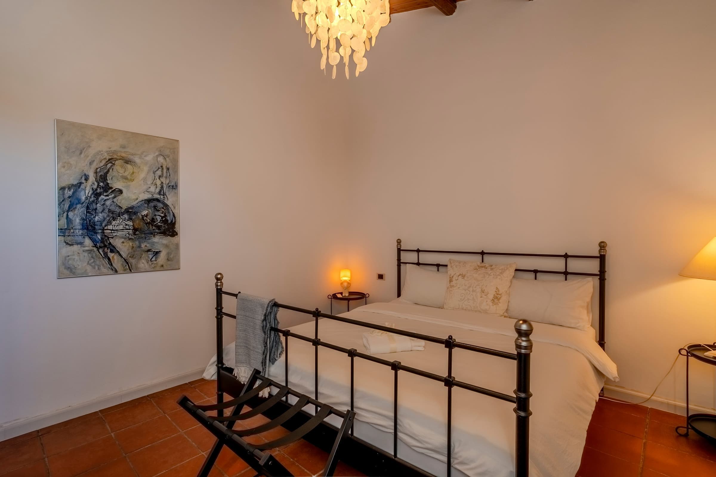 Spacious bedroom with statement chandelier