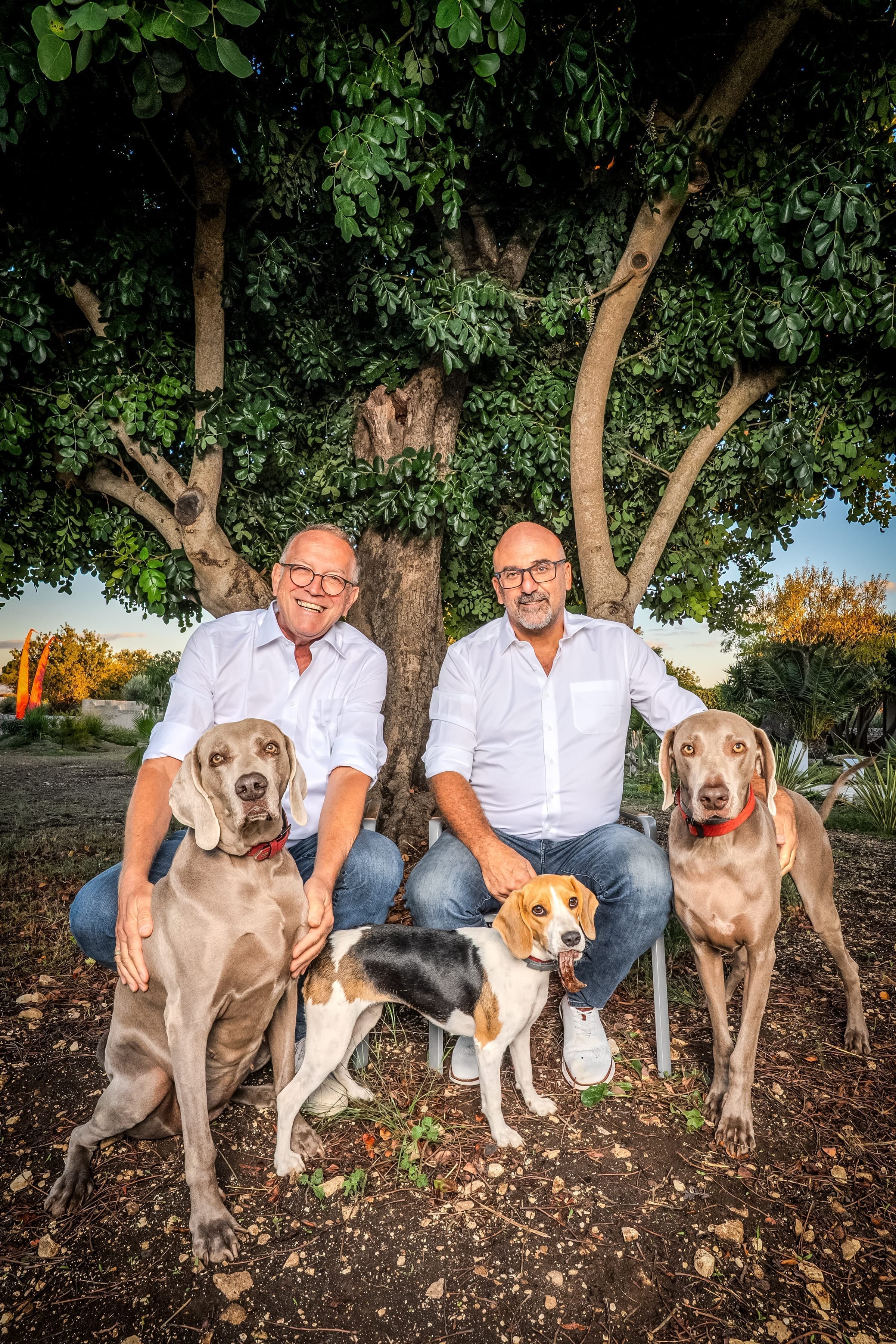 Gianandrea and Udo with their three beloved dogs